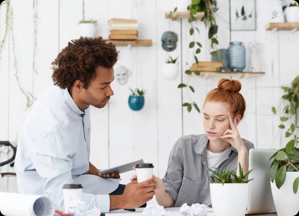 Coworker offering support to a stressed colleague during a workplace conversation