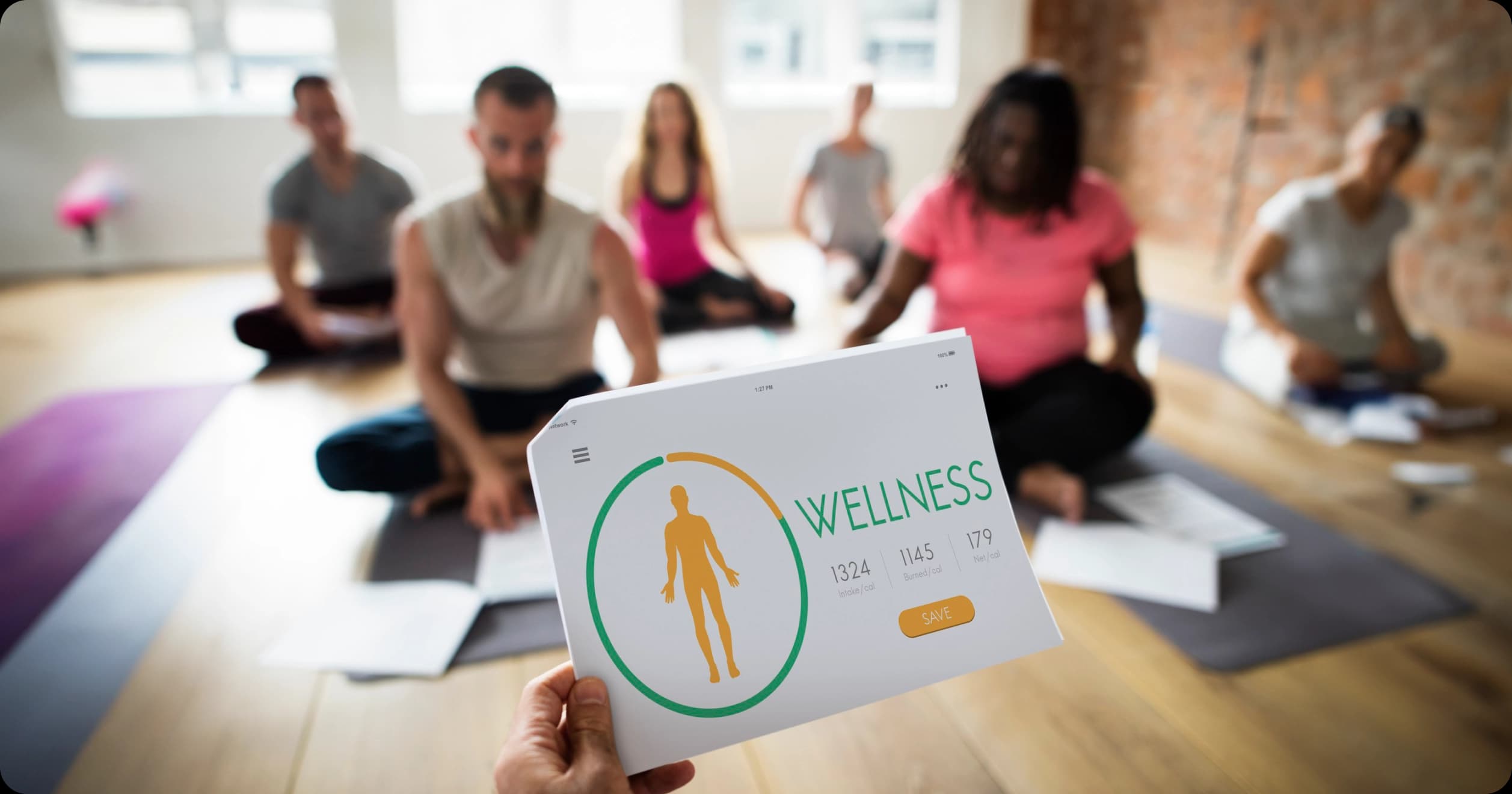 Group fitness class with wellness tracking sheet in foreground